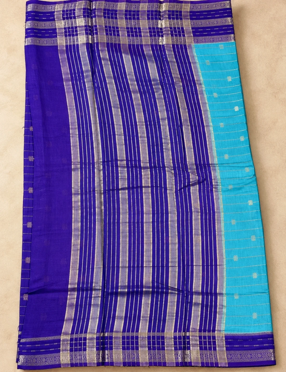 House Of Paramya turquoise Assam cotton saree with gold buti weave and a contrast purple striped border