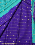 House Of Paramya turquoise Assam cotton saree with gold buti weave and a contrast purple striped border