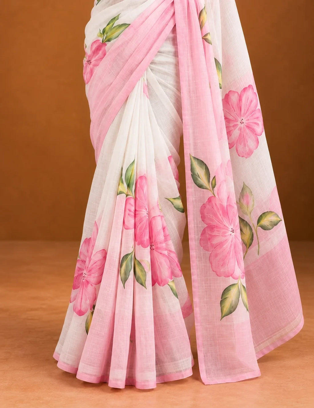 House Of Paramya white linen cotton saree featuring pink hibiscus floral prints and a delicate ombre border