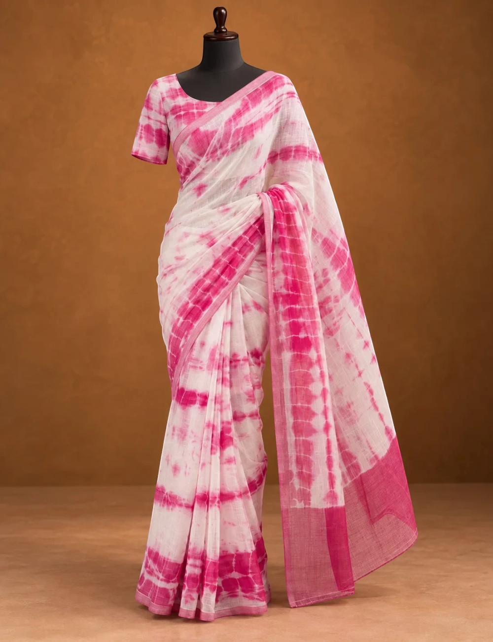 House Of Paramya white and pink linen cotton saree featuring a shibori tie-dye print and a solid pink border.