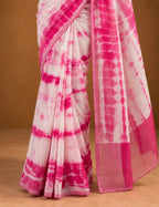 House Of Paramya white and pink linen cotton saree featuring a shibori tie-dye print and a solid pink border.