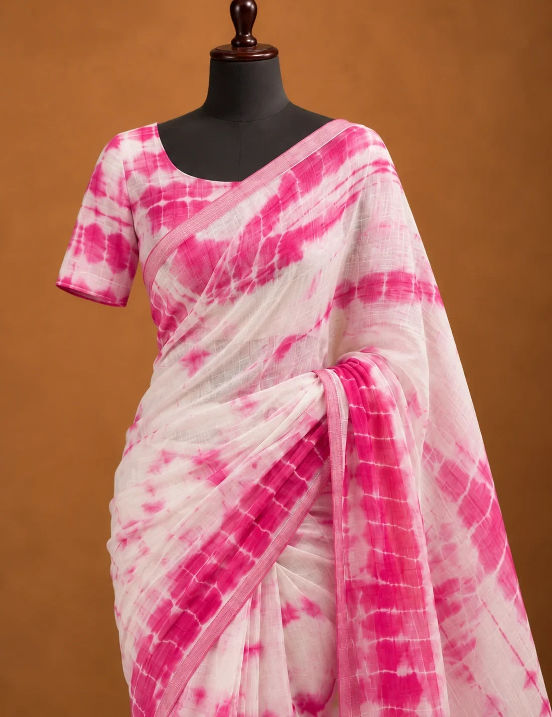 House Of Paramya white and pink linen cotton saree featuring a shibori tie-dye print and a solid pink border.