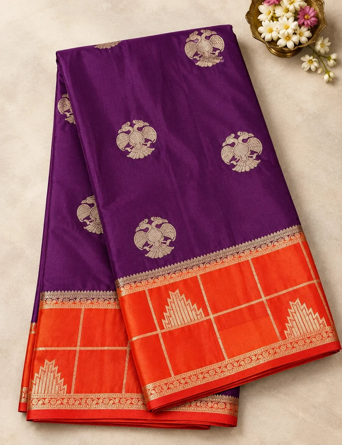 House Of Paramya deep wine Mysore silk saree with gold Gandaberunda motifs and a vibrant orange temple border.