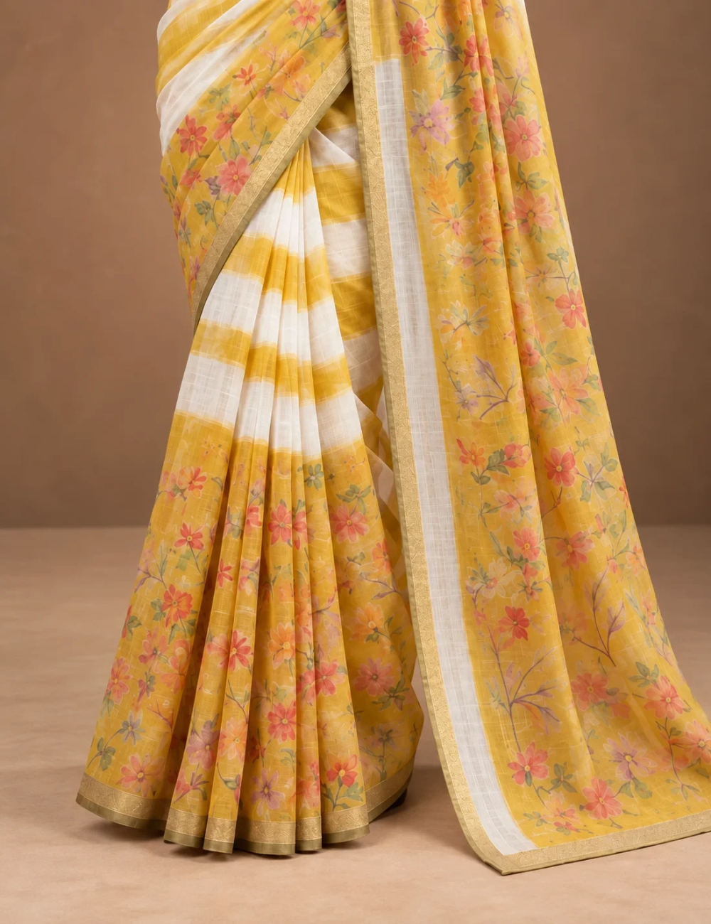 House Of Paramya yellow and white striped linen cotton saree featuring floral print panels and a gold-toned border.