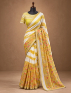 House Of Paramya yellow and white striped linen cotton saree with floral print panels and a gold-toned edge border.