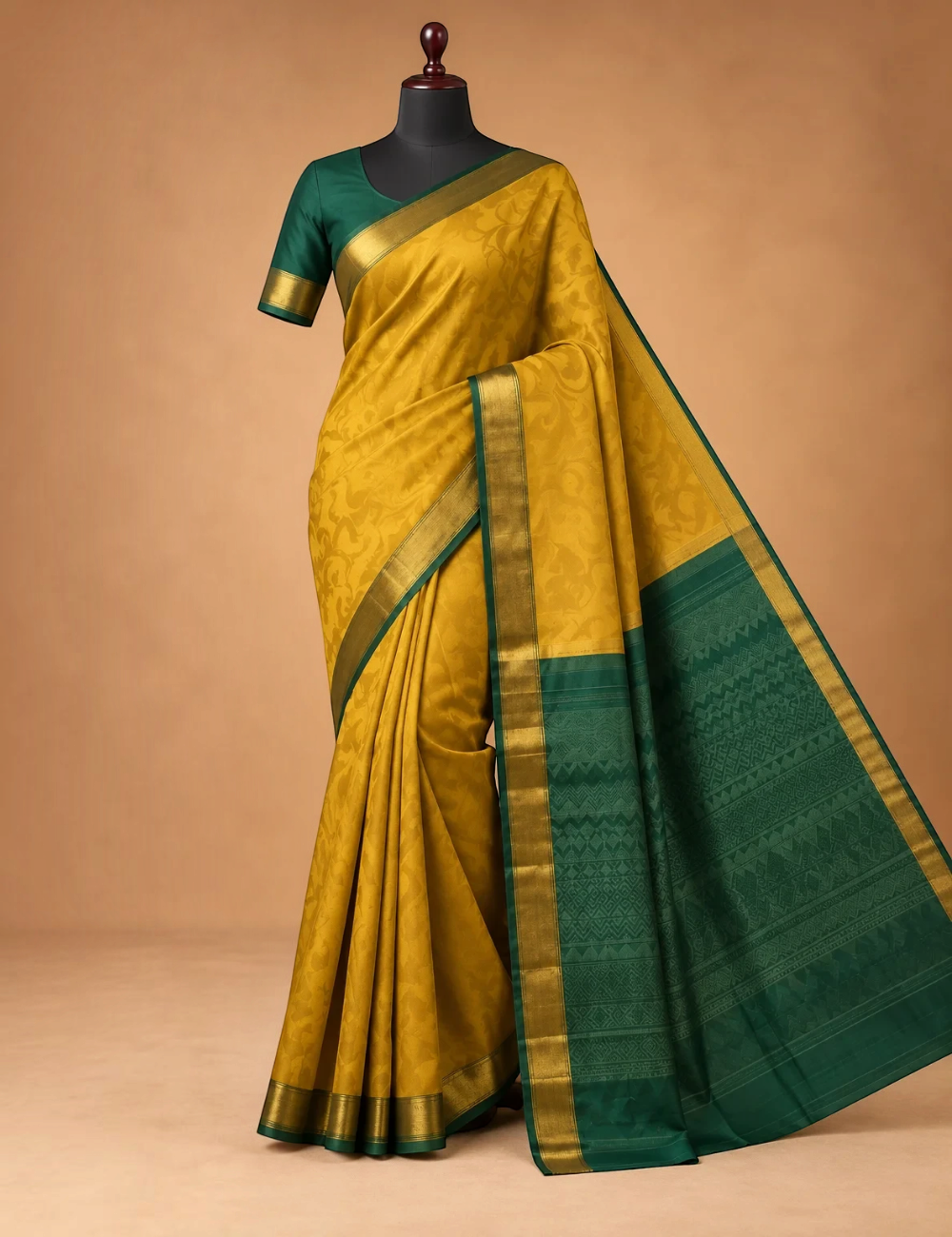 House Of Paramya yellow pure silk saree with a green border and subtle floral jacquard pattern on a mannequin