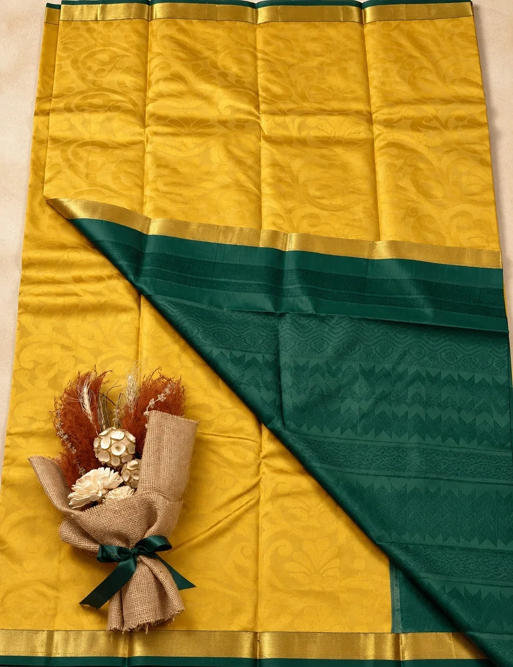 House Of Paramya yellow pure silk saree with a green border and subtle floral jacquard weave pattern