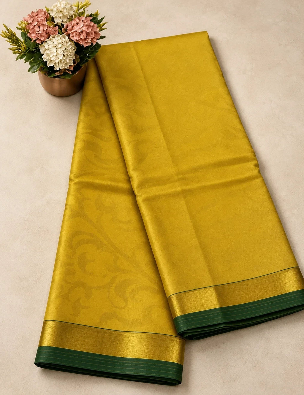 House Of Paramya yellow pure silk saree with subtle floral pattern and a minimalist green border for festive wear.