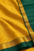 House Of Paramya yellow pure silk saree with intricate floral patterns and a contrasting green border