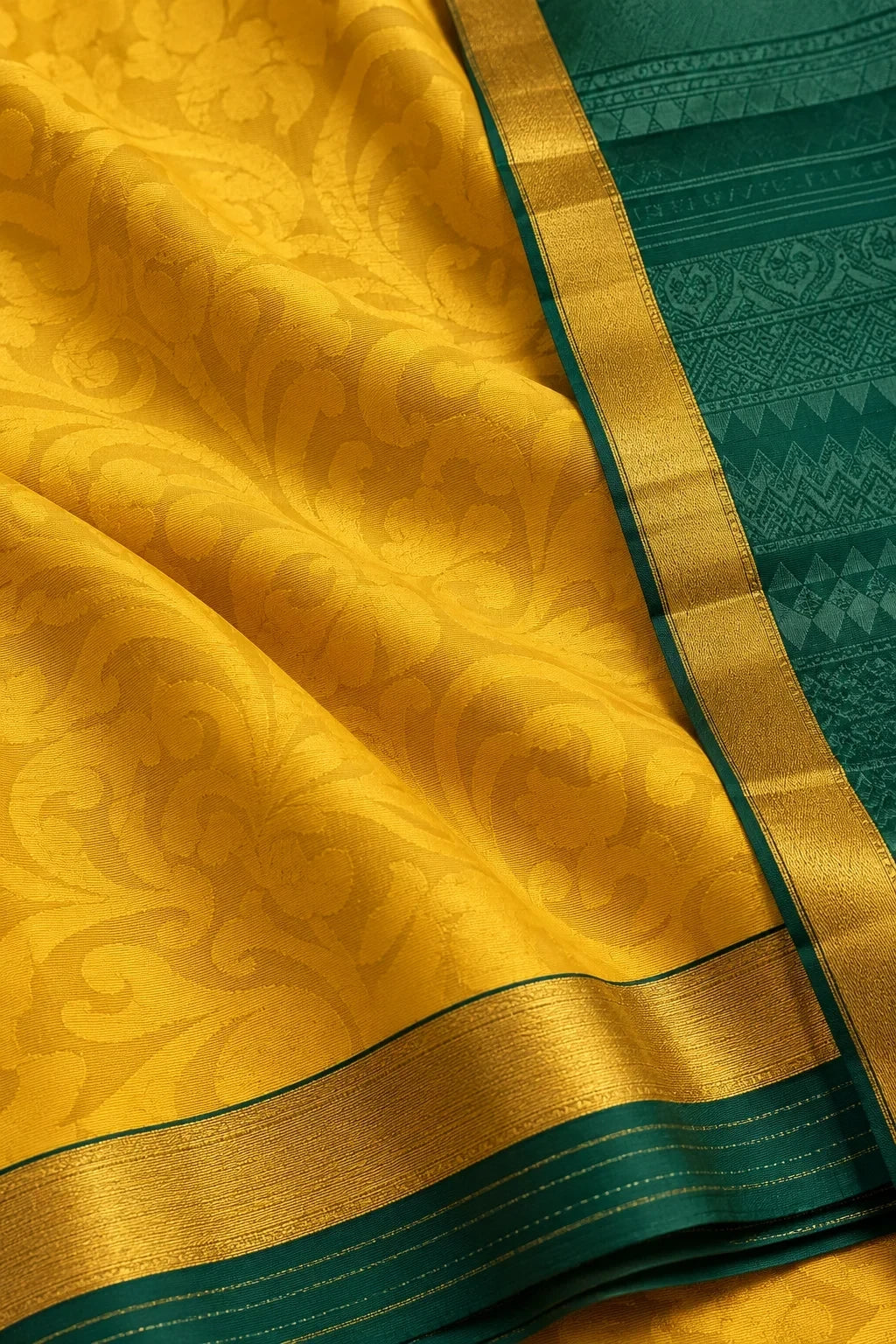 House Of Paramya yellow pure silk saree with intricate floral patterns and a contrasting green border