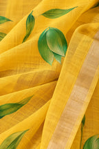 House Of Paramya yellow pure linen saree with green leaf prints and a subtle gold-toned woven border