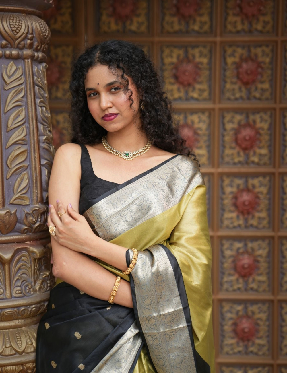 House Of Paramya olive gold and black soft silk Banarasi saree with silver-gold zari border worn by a woman